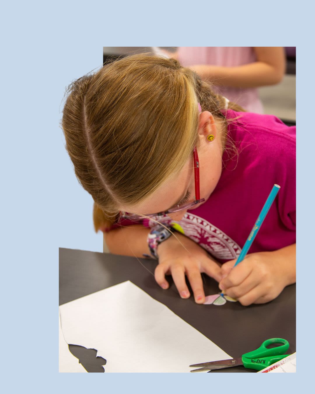 A closeup of a hand holding a small container of beer