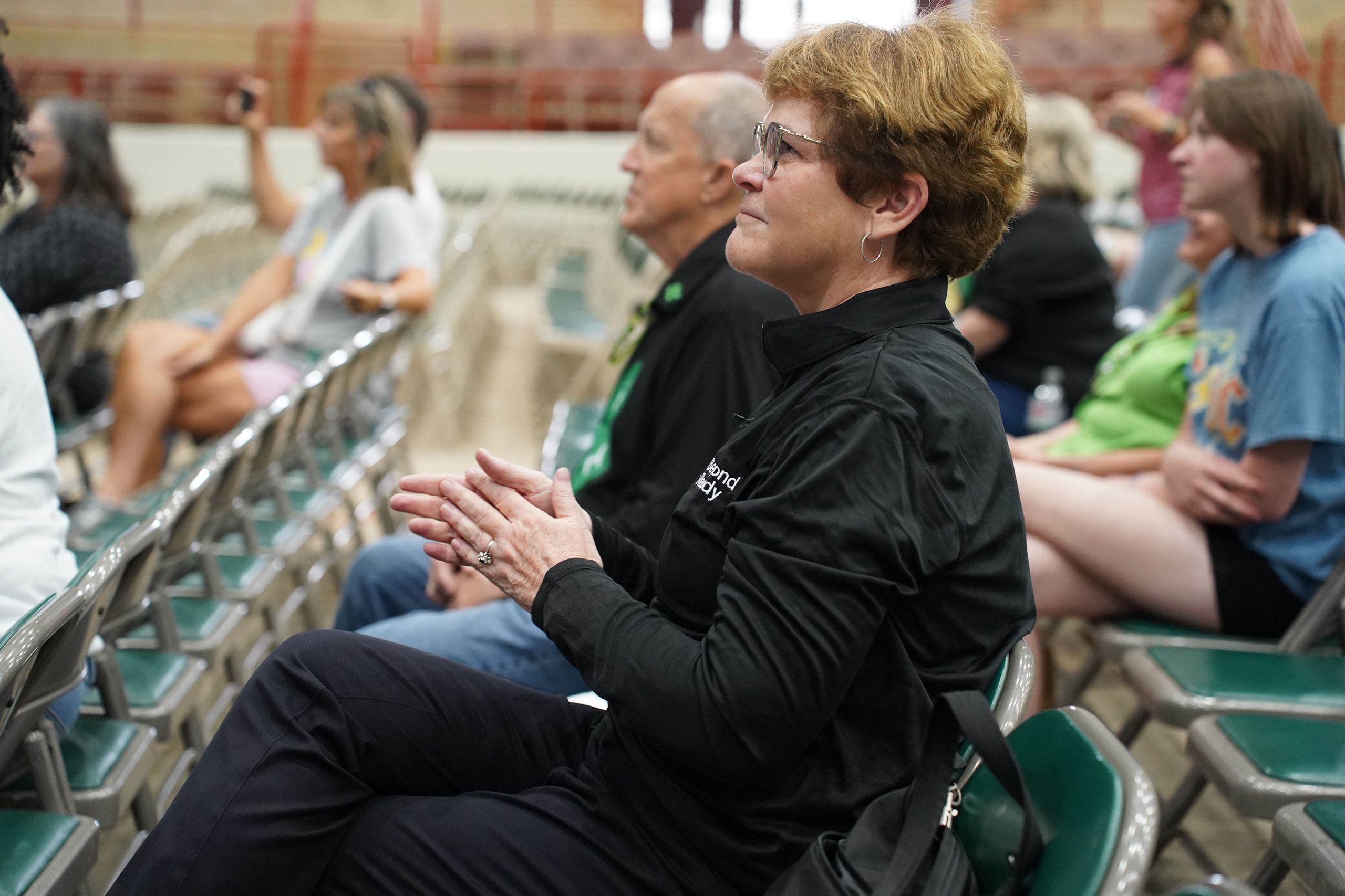 Audience members applaud for a performance by Clovers and Co. at 4-H Day at the Fair. 