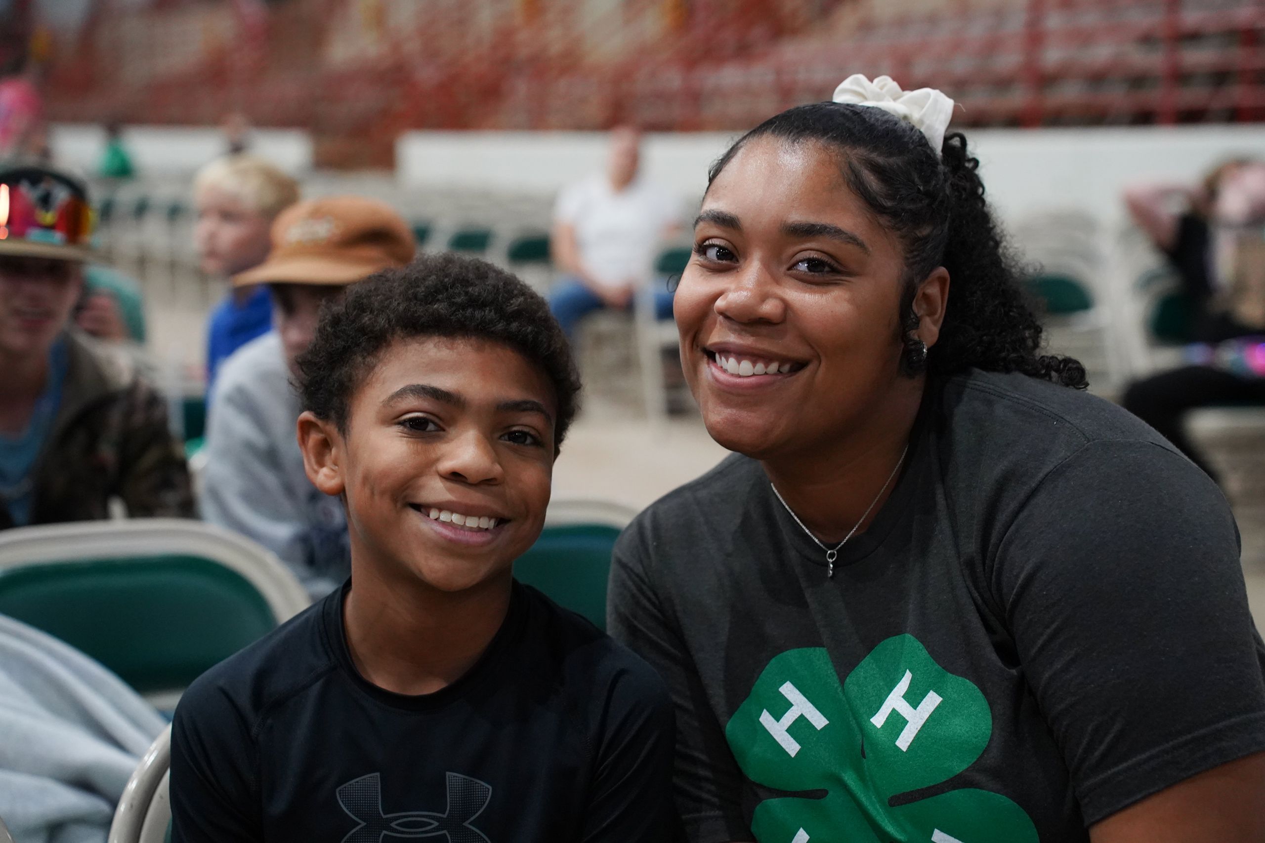 A 4-H'er and an adult show their smiles at the Georgia National Fair. 