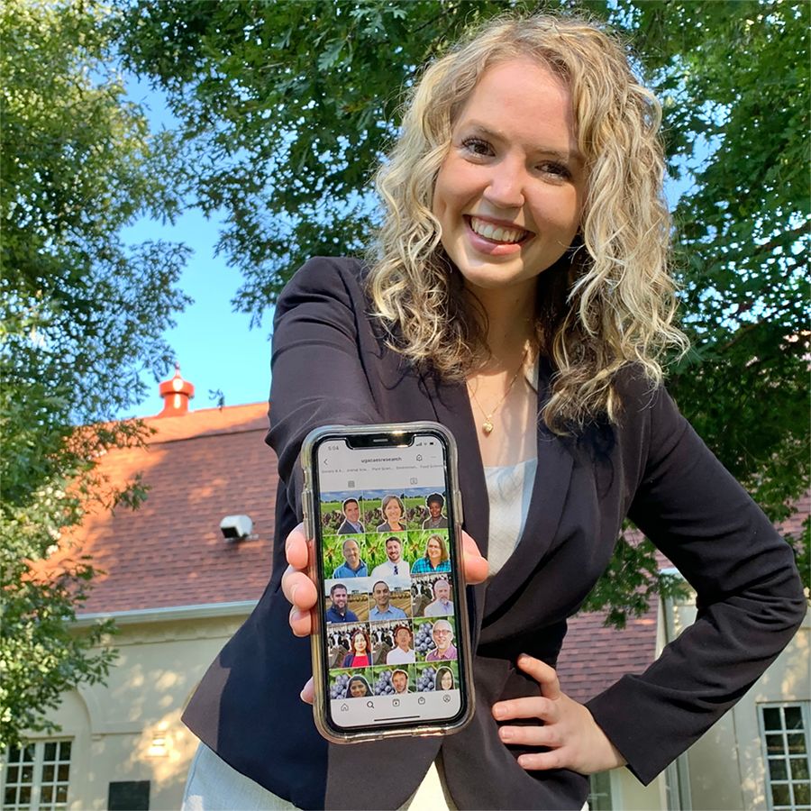 Allison Fortner displays the screen of an iPhone. The screen features the @ugacaesresearch Instagram feed.