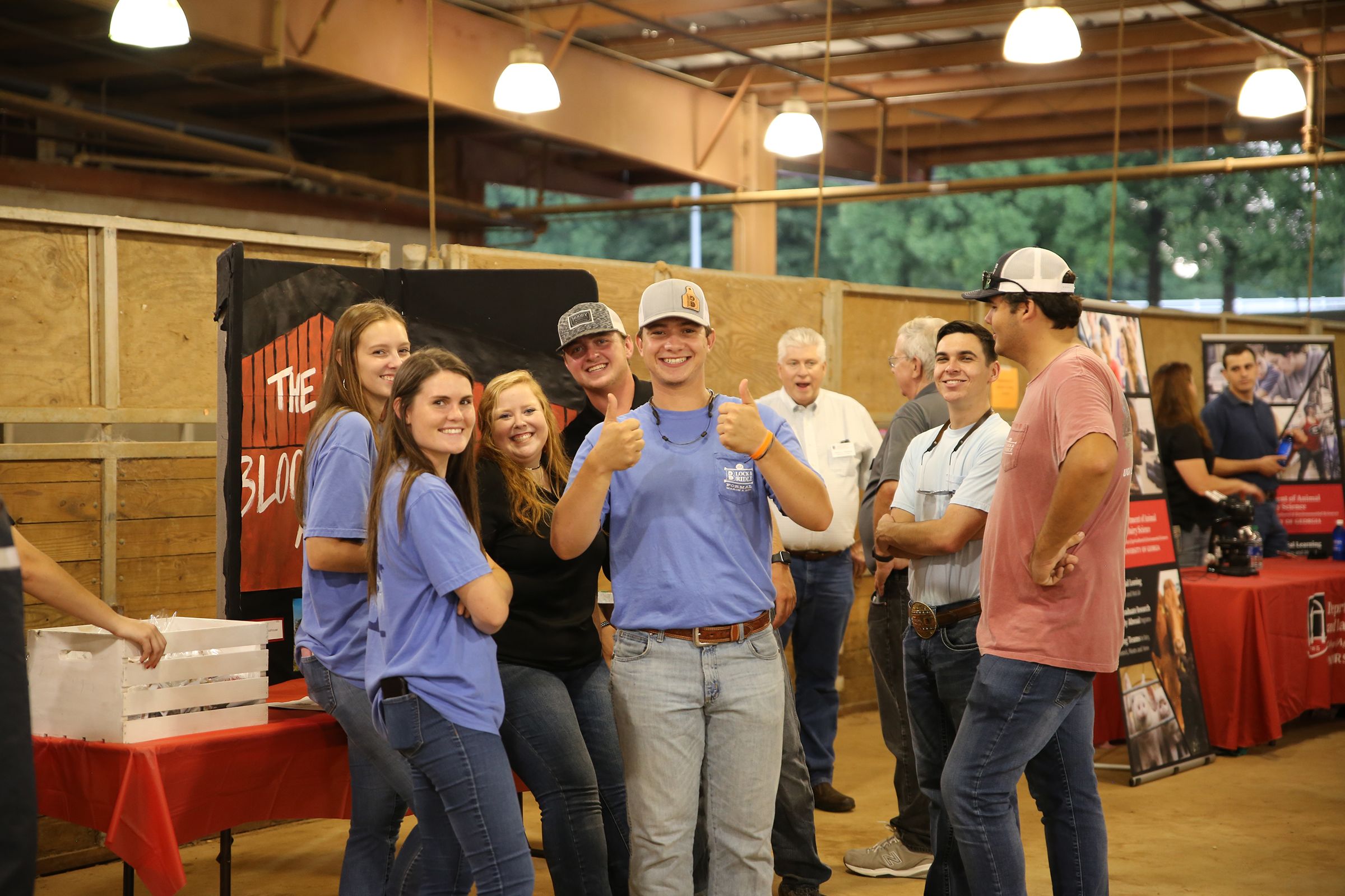 Members of the Block and Bridle Club pause for a photo in the livestock area during the 2021 Ag Dawg Kickoff.
