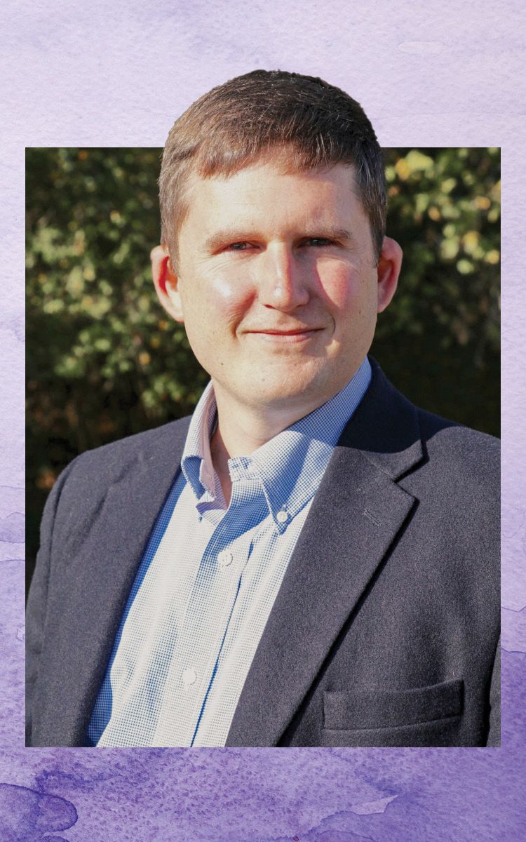 Ben Campbell wears a blue suit in his professional headshot