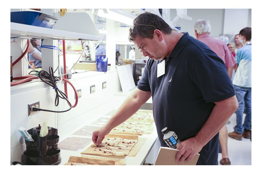A participant in the 2022 Georgia Peanut Tour examines sprouted peanut seeds in the seed lab at the U.S. Department of Agriculture’s National Peanut Research Laboratory in Dawson, Georgia.