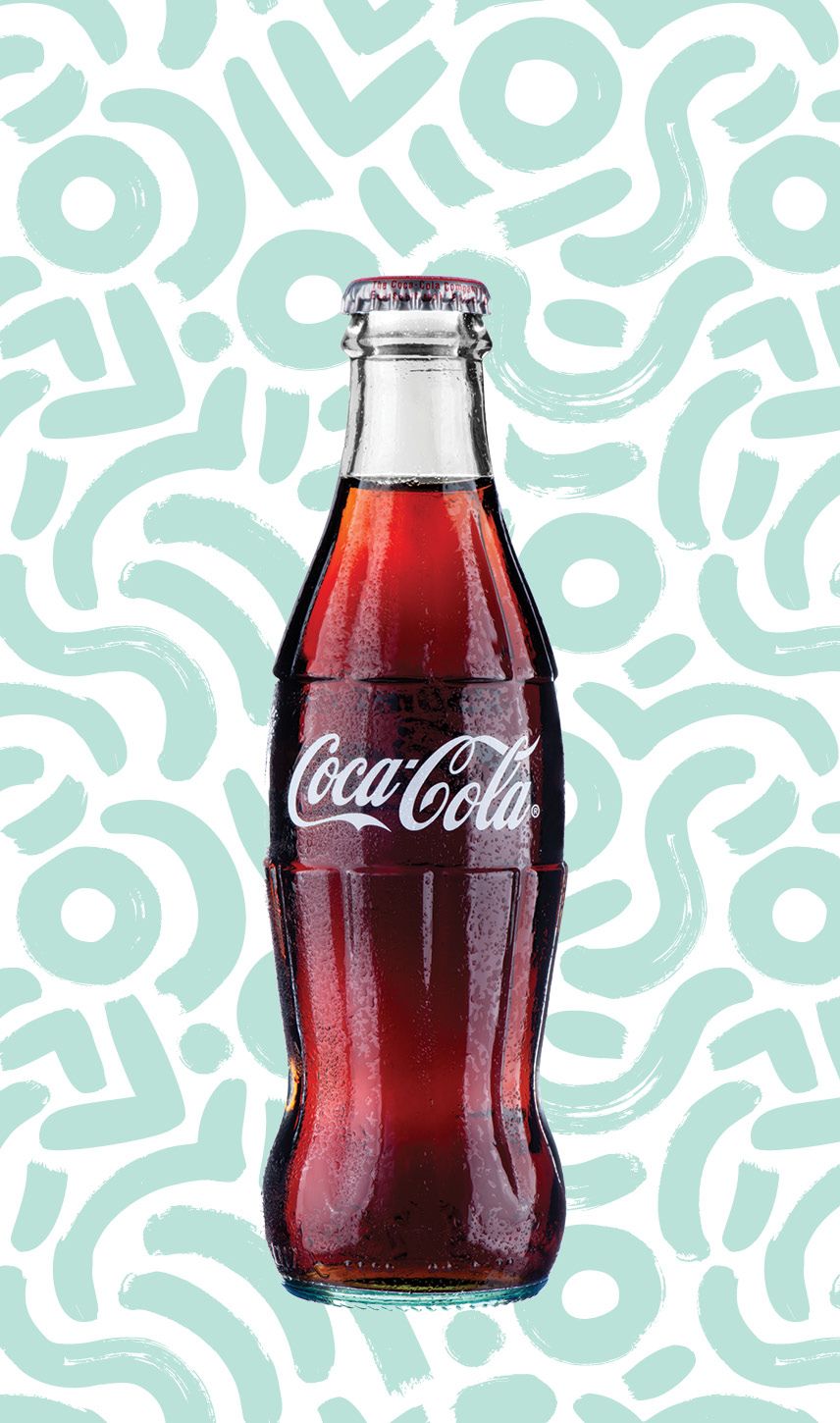 A photo of a glass Coca-Cola bottle, with light turquoise swirls behind it in the background.