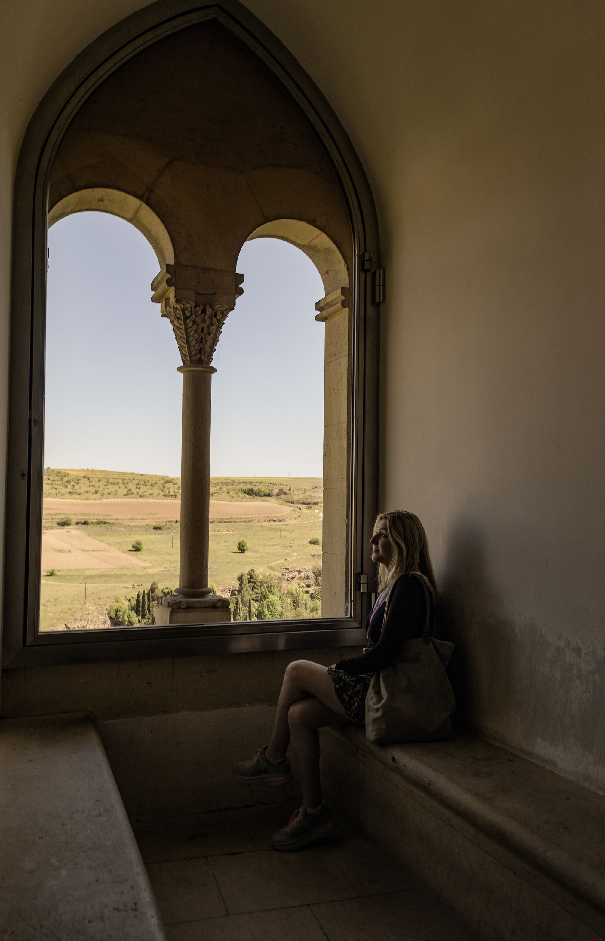 View of cropland through a window in Segovia, Spain